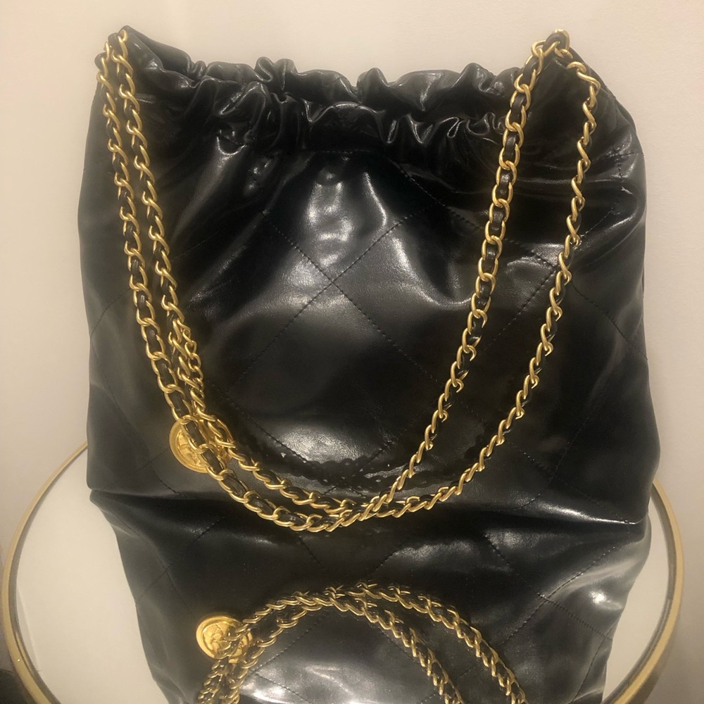 Luxurious Black and Gold Shoulder Bag with Chain Detail